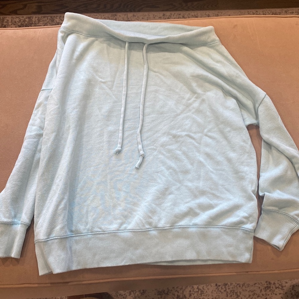 Woman’s off the shoulders sweater!